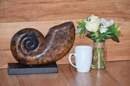 Decorative hand carved wooden shell on stand